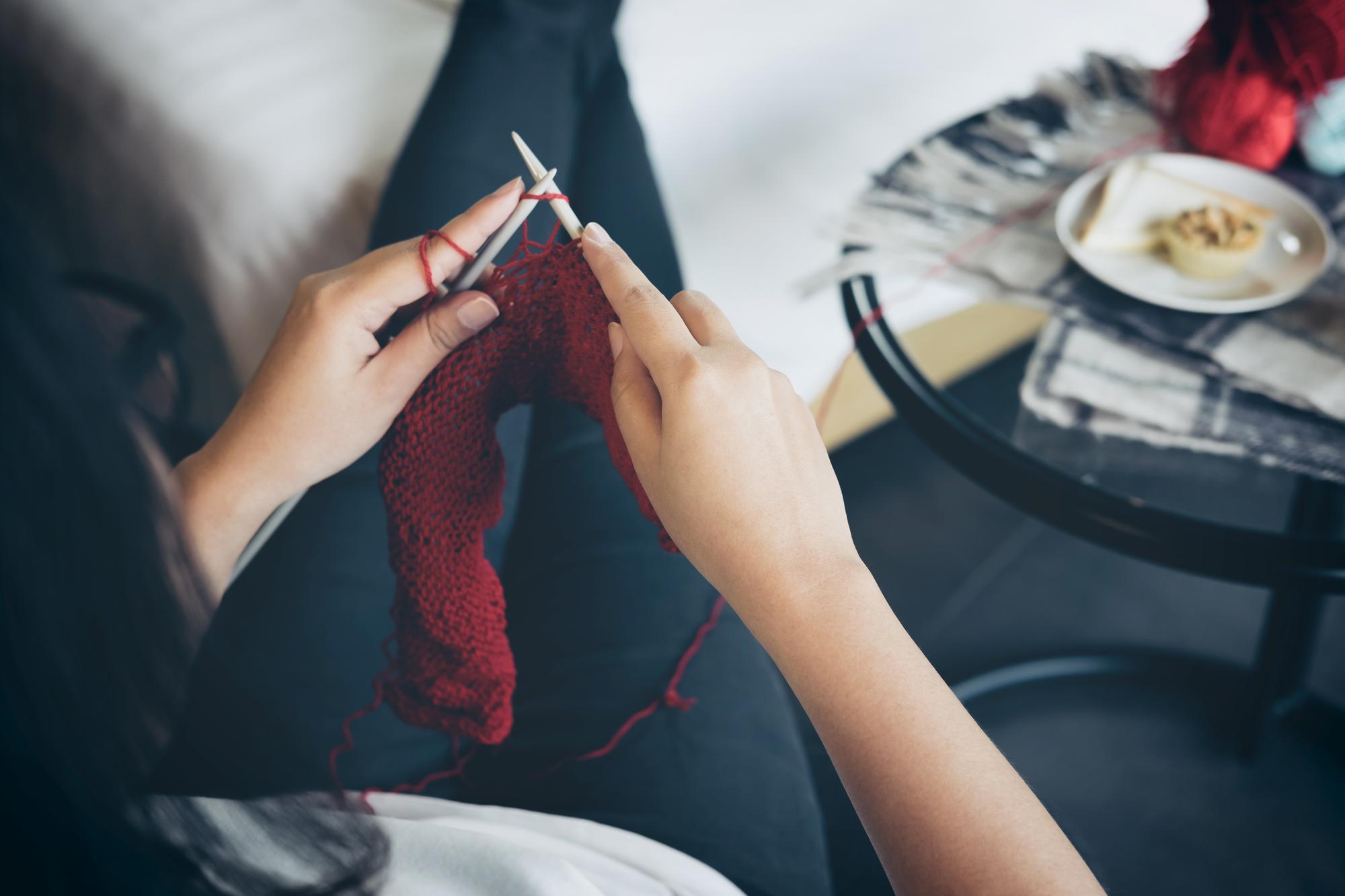 Artist at work stitching fine detail