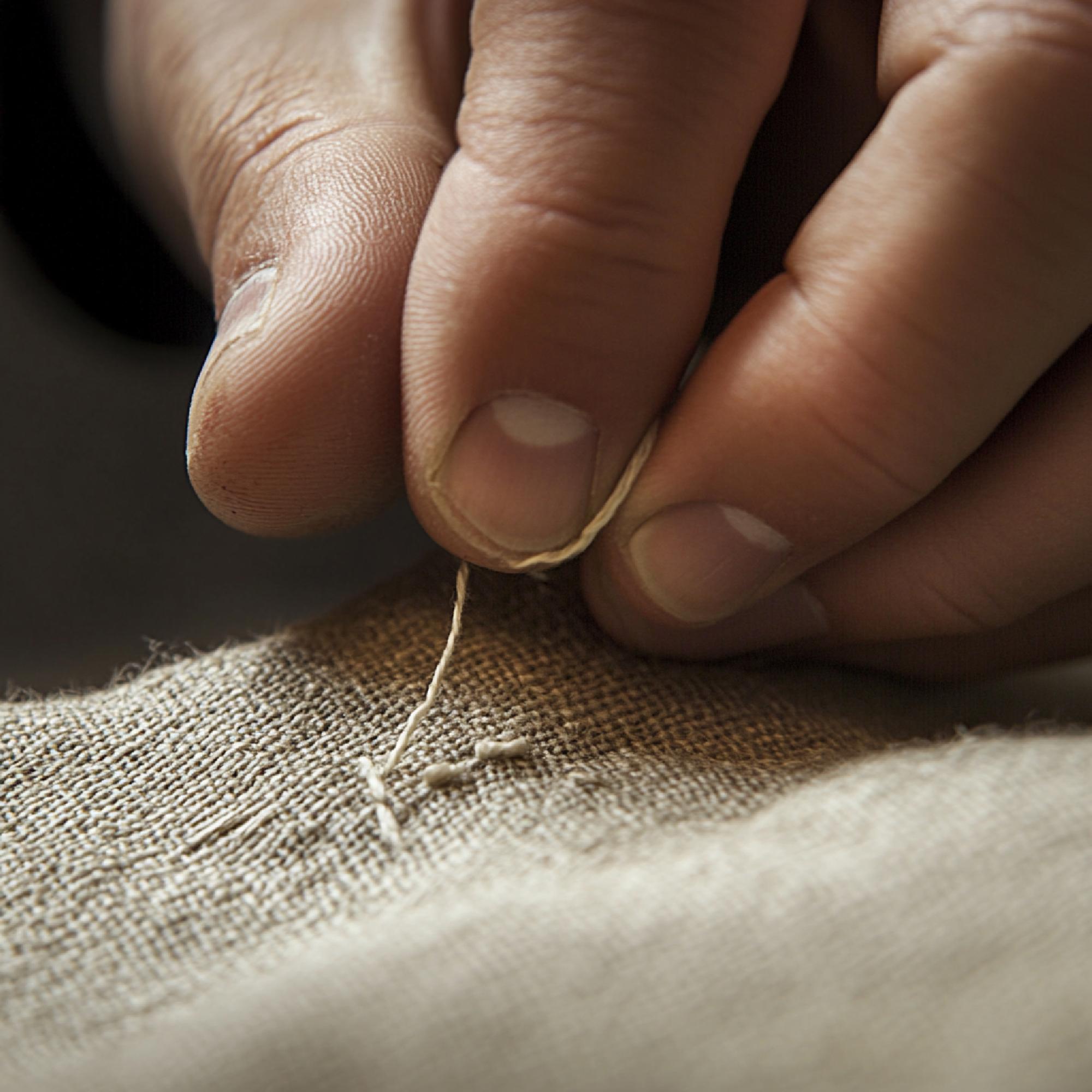 Close-up of artisanal hand embroidery on linen